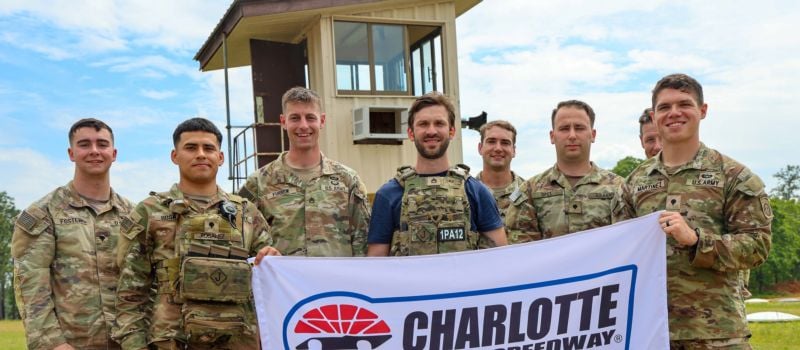 Coca-Cola Racing Family driver Daniel Suarez poses with members of the 82nd Airborne Division during an action packed Mission 600 visit to Fort Bragg on Wednesday, April 23, 2025.