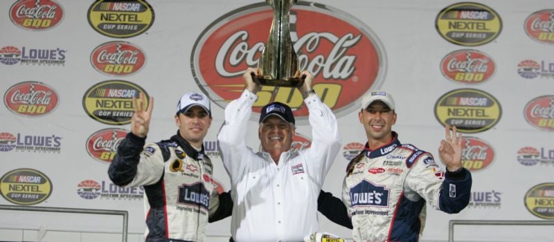 Hendrick Motorsports — Jimmie Johnson (left), team owner Rick Hendrick (center) and crew chief Chad Knaus (right) — celebrate in Victory Lane after Johnson’s third consecutive Coca-Cola 600 win in 2005 at Charlotte Motor Speedway.