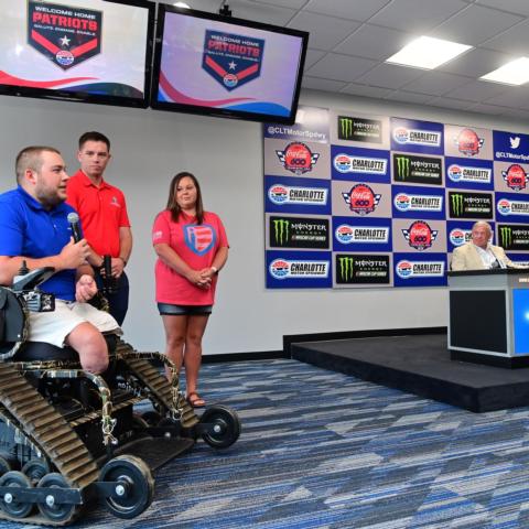 U.S. Navy veteran Doug Hill, left, speaks during a presentation prior to Sunday's Coca-Cola 600.