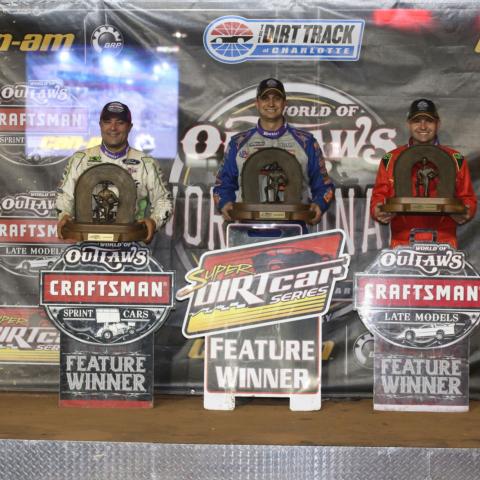 World of Outlaws Craftsman Sprint Cars champion Donny Schatz, left, joins Super DIRTcar Series big-block modified champion Matt Sheppard, middle, and World of Outlaws Craftsman Late Models champion Mike Marlar on stage during Saturday's sold-out World of Outlaws World Finals presented by Can-Am at The Dirt Track at Charlotte.