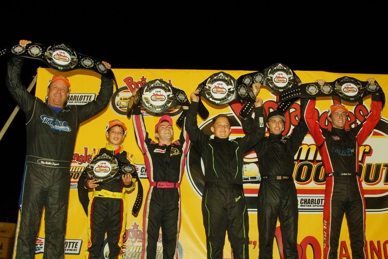 Bojangles' Summer Shootout champions (from left) Robby Faggart, Bryson Ruff, Matthew Davey, Giovanni Bromante, Tyler Truex and Jordan Black celebrate with their title belts on Tuesday. 