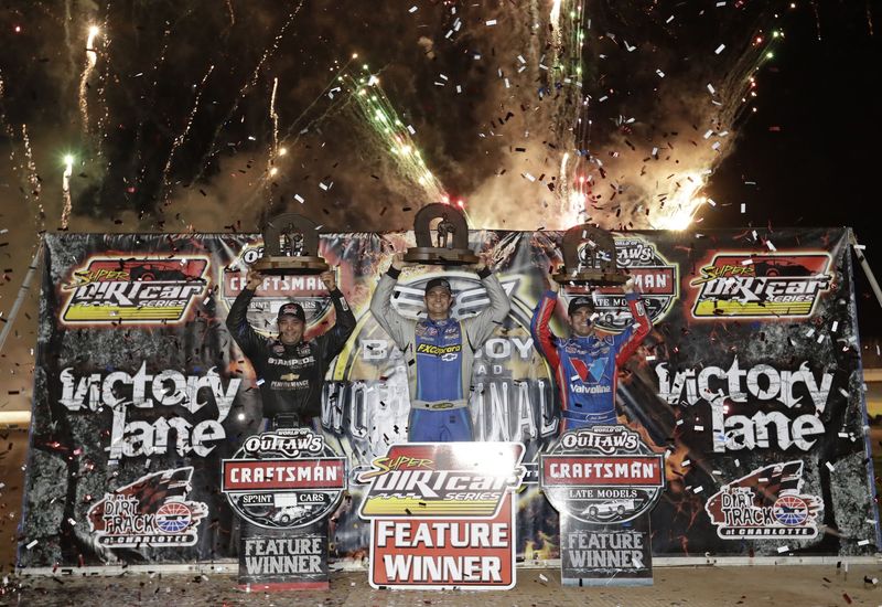 World of Outlaws Craftsman Sprint Car champion Donny Schatz, left, Super DIRTcar Big-Block Modified champion Matt Sheppard, center, and World of Outlaws Craftsman Late Model champion Josh Richards celebrate after Saturday's Bad Boy Off Road World of Outlaws World Finals at The Dirt Track at Charlotte.