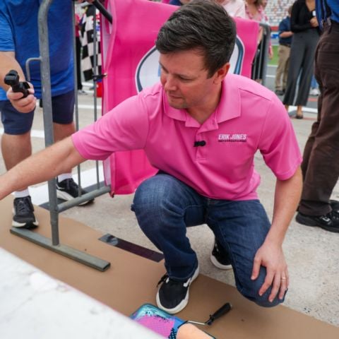 Erik Jones painted pit wall during the 13th annual Paint Pit Wall Pink event in conjunction with Blue Cross NC, ahead of the Bank of America ROVAL™ 400 weekend at Charlotte Motor Speedway.