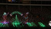 The grandstands light up with holiday cheer during the seventh annual Speedway Christmas drive-through light show at Charlotte Motor Speedway.