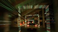 A car drives through a tunnel of lights along the concourse of Charlotte Motor Speedway during the seventh annual Speedway Christmas.