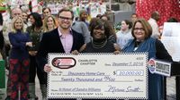 Speedway Children's Charities surprised Discovery Home Care co-founder Tammy Legette with an additional $20,000 during the 2016 Speedway Children's Charities grant distribution event Wednesday at Charlotte Motor Speedway.