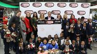 Speedway Children's Charities officials and children representing the 93 groups that received grants from the Charlotte chapter this year pose for a photo during the 2016 Speedway Children's Charities grant distribution event Wednesday at Charlotte Motor Speedway.