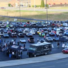 Cars filled the fan zone parking lot during the inaugural Cars and Coffee Concord at Charlotte Motor Speedway.