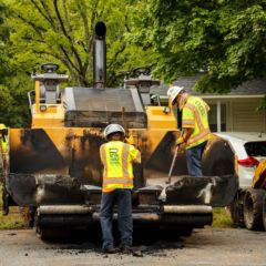 Charlotte Motor Speedway partnered with Reeves Construction to repave a driveway at one of the Cooperative Christian Ministries teaching houses in Kannapolis as part of the speedway's fifth annual Day of Service.