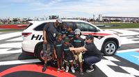 Youth from the Boys & Girls Club of Cabarrus County during Saturday's Hisense 4K TV 300 at Charlotte Motor Speedway.