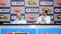 Newly minted NASCAR Hall of Famer Mark Martin shares stories with speedway president and general manager Marcus Smith during Saturday's festivities at Charlotte Motor Speedway.