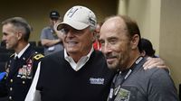 Lee Greenwood and Rick Hendrick pose for a photo at the Coca-Cola 600 at Charlotte Motor Speedway.