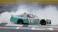 Denny Hamlin celebreates with a burnout following Saturday's Hisense 4K TV 300 at Charlotte Motor Speedway.