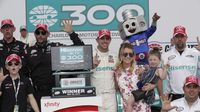 Denny Hamlin celebrates in Victory Lane following Saturday's Hisense 4K TV 300 at Charlotte Motor Speedway.