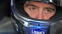 Jimmie Johnson sits in his car during Bojangles' Pole Night at Charlotte Motor Speedway.
