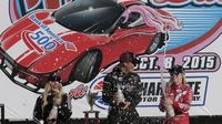 The top three finishers in the Better Half Dash -- Tandra Greenfield (3rd place), Shannon Kock (1st place) and Katelyn Sweet (2nd place) celebrate in Victory Lane during Bojangles' Pole Night at Charlotte Motor Speedway.