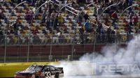 Austin Dillon does a burnout following his Friday Drive for the Cure 300 presented by Blue Cross Blue Shield of North Carolina win at Charlotte Motor Speedway.