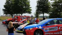 Fans check out some of the cars on display before the seventh annual Parade of Power at Charlotte Motor Speedway on Wednesday.