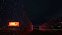 A tunnel of lights awaits runners at the start of the third annual Egg Nog Jog 5K during opening night of the sixth annual Speedway Christmas at Charlotte Motor Speedway.