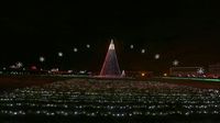 A giant illuminated Christmas tree greets visitors during opening night of the sixth annual Speedway Christmas at Charlotte Motor Speedway.