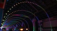 Cars drive through the concourse during opening night of the sixth annual Speedway Christmas at Charlotte Motor Speedway.