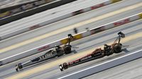 Tony Schumacher and Richie Crampton battle during elimination Sunday at the NHRA Carolina Nationals at zMAX Dragway.