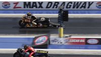 Shawn Gann and Chaz Kennedy race Pro Stock Motorcycles during opening day at the NHRA Carolina Nationals at zMAX Dragway.