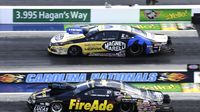 Larry Morgan and Allen Johnson race side-by-side during opening day at the NHRA Carolina Nationals at zMAX Dragway.