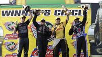 Andrew Hines (PSM), Erica Enders (PS), Del Worsham (FC) and Antron Brown (TF) celebrate wins during elimination Sunday at the NHRA Carolina Nationals at zMAX Dragway.