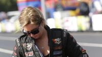 Erica Enders gets in her car in the staging lanes before making a qualifying pass during opening day at the NHRA Carolina Nationals at zMAX Dragway.