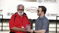 Charlotte Motor Speedway President and General Manager Marcus Smith presented longtime speedway employee Harlan Hoover with the Tony Plummer Award during Thursday's LiftMaster Pole Night at Charlotte Motor Speedway.