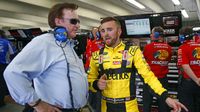 Team owner Richard Childress and driver Austin Dillon talk in the garage during Thursday's LiftMaster Pole Night at Charlotte Motor Speedway.