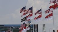 Flags fly over the infield during Thursday's LiftMaster Pole Night at Charlotte Motor Speedway.