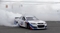 Clint Bowyer does a burnout in front of hundreds of fans during the eighth annual Parade of Power at Charlotte Motor Speedway.