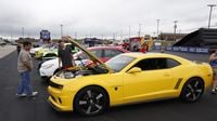 Fans check out some of the amazing rides on display during the eighth annual Parade of Power at Charlotte Motor Speedway.
