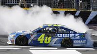 Jimmie Johnson celebrates his fourth Bank of America 500 win during a rare Sunday Bank of America 500/Drive for the Cure 300 doubleheader at Charlotte Motor Speedway.