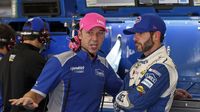 Jimmie Johnson and Chad Knaus talk in the garage during Thursday's Bojangles' Pole Night at Charlotte Motor Speedway.
