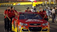 Alex Bowman's team pushes his car to the qualifying grid during Thursday's Bojangles' Pole Night at Charlotte Motor Speedway.