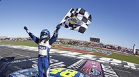Jimmie Johnson celebrates his fourth Bank of America 500 win during a rare Sunday Bank of America 500/Drive for the Cure 300 doubleheader at Charlotte Motor Speedway.