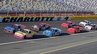 XFINITY Series drivers race through Turn 4 during a rare Sunday Bank of America 500/Drive for the Cure 300 doubleheader at Charlotte Motor Speedway.