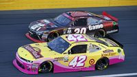 Kyle Larson races side-by-side with Dakodt Armstrong during a rare Sunday Bank of America 500/Drive for the Cure 300 doubleheader at Charlotte Motor Speedway.