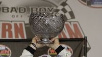 NASCAR Whelen Southern Modified Tour driver Burt Myers celebrates his championship following the Bad Boy Off Road Southern Slam 150 during Thursday's Bojangles' Pole Night at Charlotte Motor Speedway.