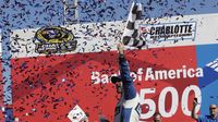 Jimmie Johnson celebrates his fourth Bank of America 500 win during a rare Sunday Bank of America 500/Drive for the Cure 300 doubleheader at Charlotte Motor Speedway.