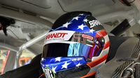 Justin Allgaier sits in his car before practice during Thursday's Bojangles' Pole Night at Charlotte Motor Speedway.