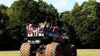 Fans enjoy a ride-along during the Circle K Back-to-School Monster Truck Bash at The Dirt Track at Charlotte.