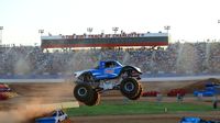 Bigfoot flies through the air in front of a sold-out crowd during the Circle K Back-to-School Monster Truck Bash at The Dirt Track at Charlotte.