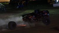 Heavy Hitter loses a tire during the Circle K Back-to-School Monster Truck Bash at The Dirt Track at Charlotte.