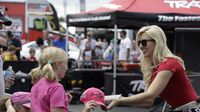 Courtney Force signs autographs for fans during Saturday's qualifying action at the NHRA 4-Wide Nationals presented by Lowes Foods.