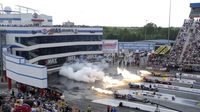 Four-wide jet car racing lights up the start line during Saturday's qualifying action at the NHRA 4-Wide Nationals presented by Lowes Foods.