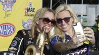 Sisters Courtney and Brittany Force take a selfie after Brittany's second career Top Fuel win during elimination Sunday at the NHRA 4-Wide Nationals presented by Lowes Foods.